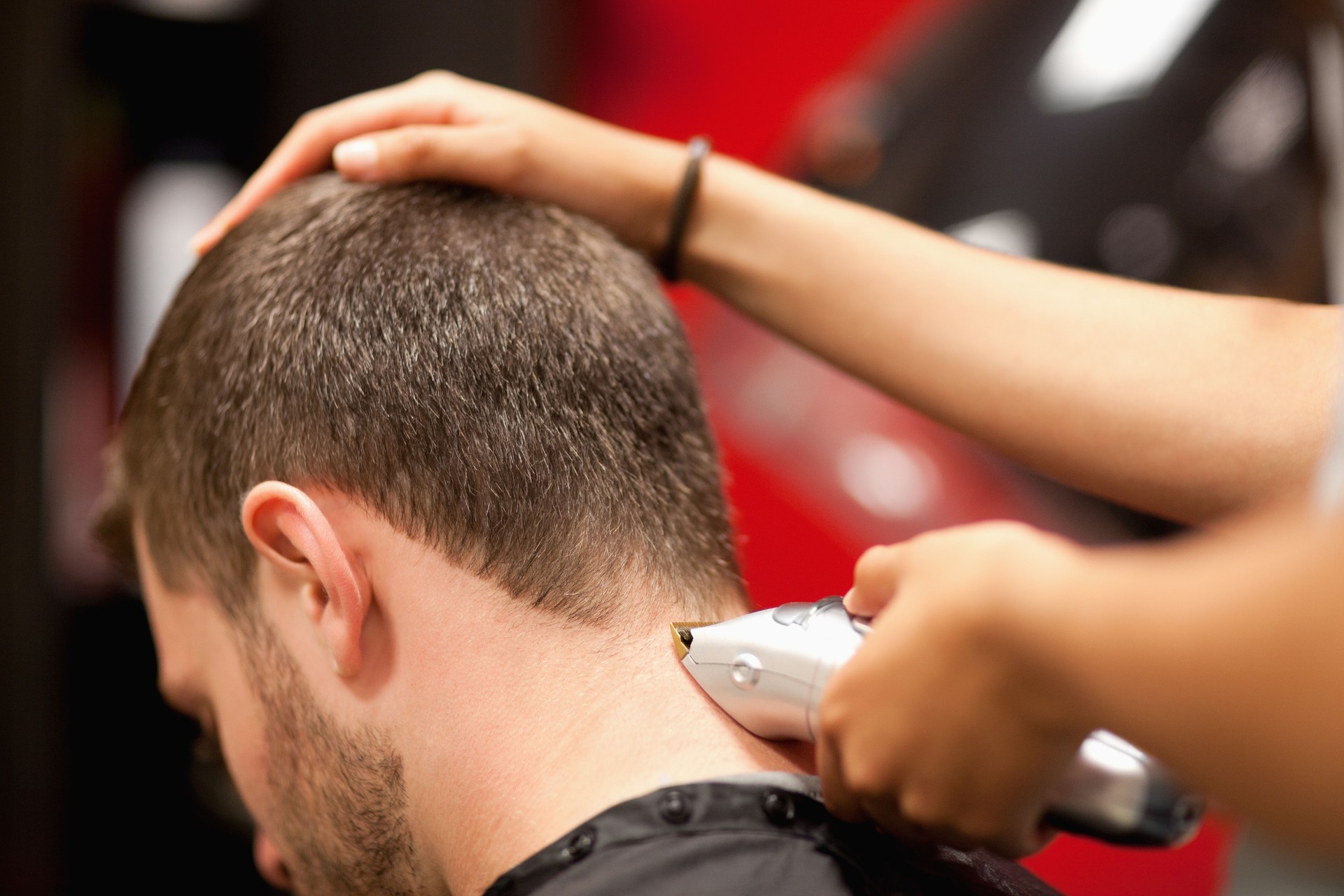 Close up of a male student having a haircut